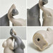 intertwined elephant figurines