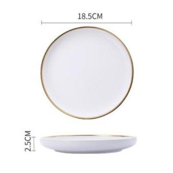 white dinner plate with gold trim