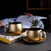 Gold cup and saucer set